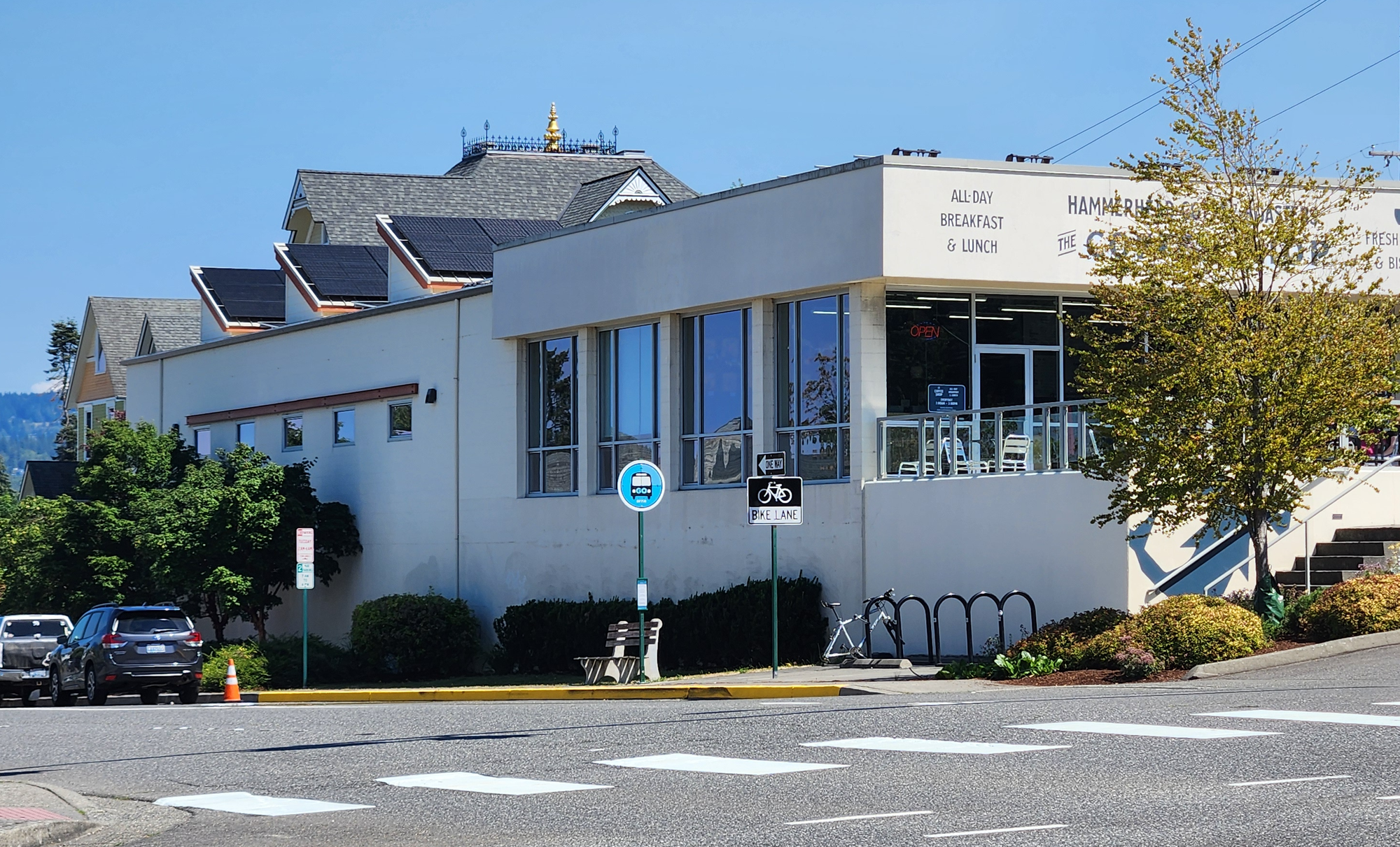 Looking across the street at The Coffee Shop by Hammerhead Coffee Roasters, with a new bus stop.