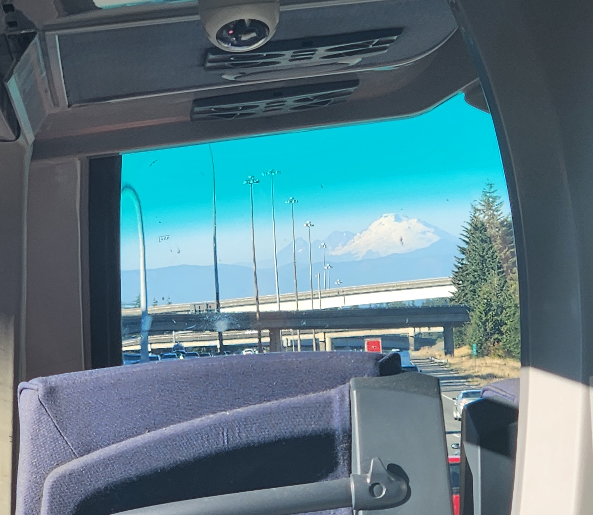 The view of Koma Kulshan (Mount Baker) from the top level of a double-decker Sound Transit Express Route 512 bus traveling toward Everett in Interstate 5's HOV lanes. 