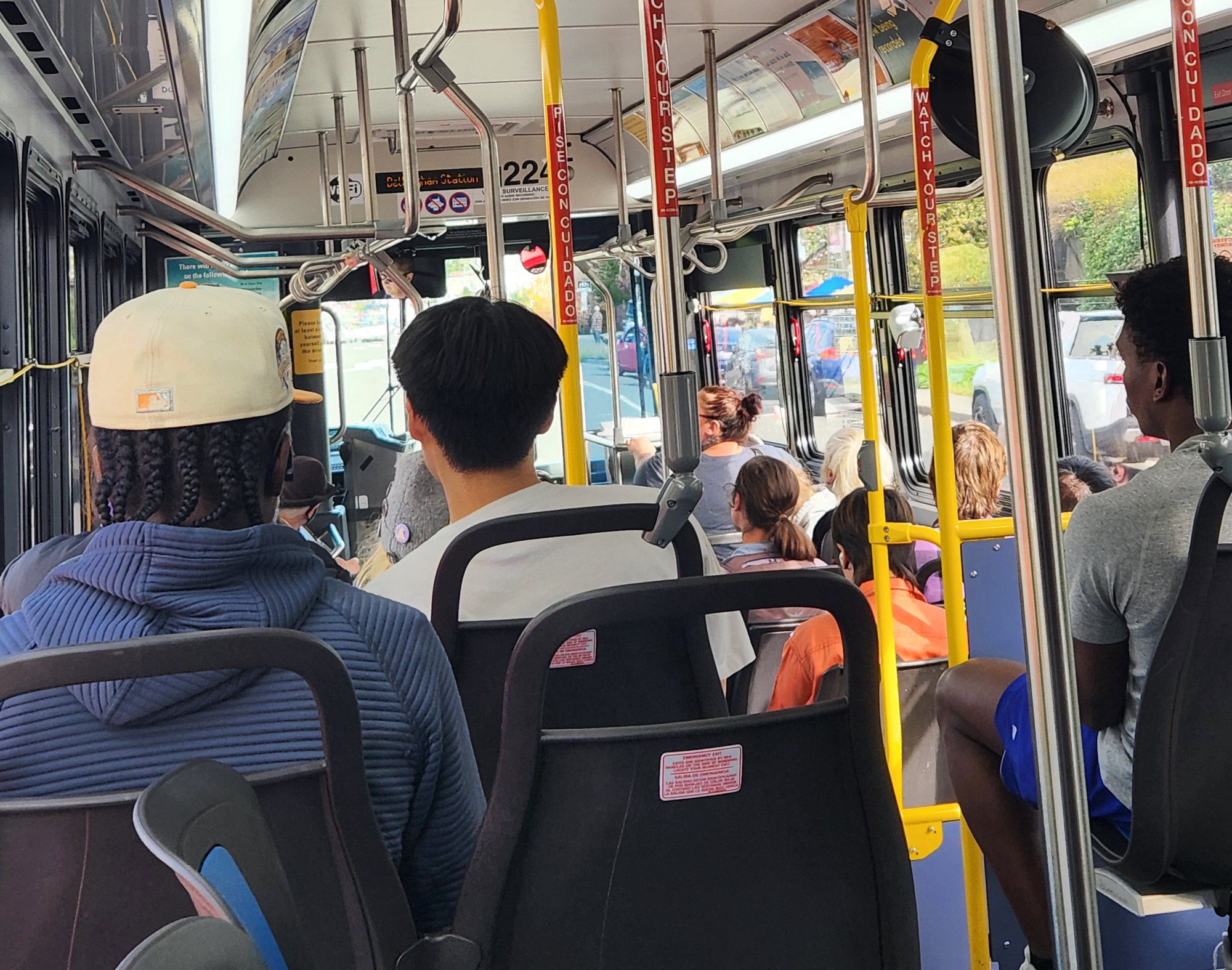 Approximately a dozen passengers ride a Route 1 bus.