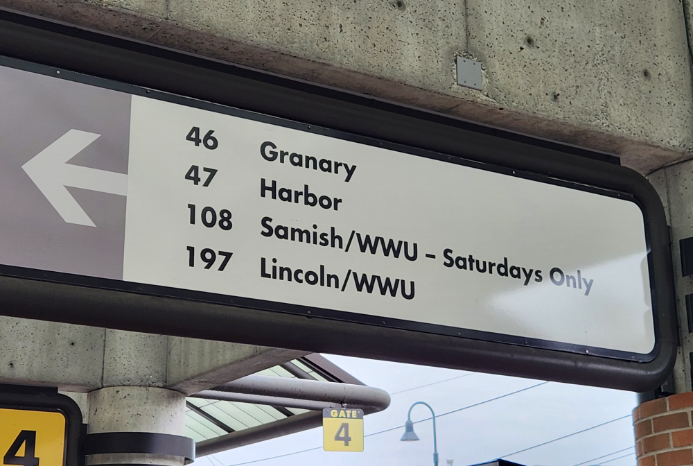 A sign showing bus boarding bays for Route 46 (Granary) and Route 47 (Harbor).