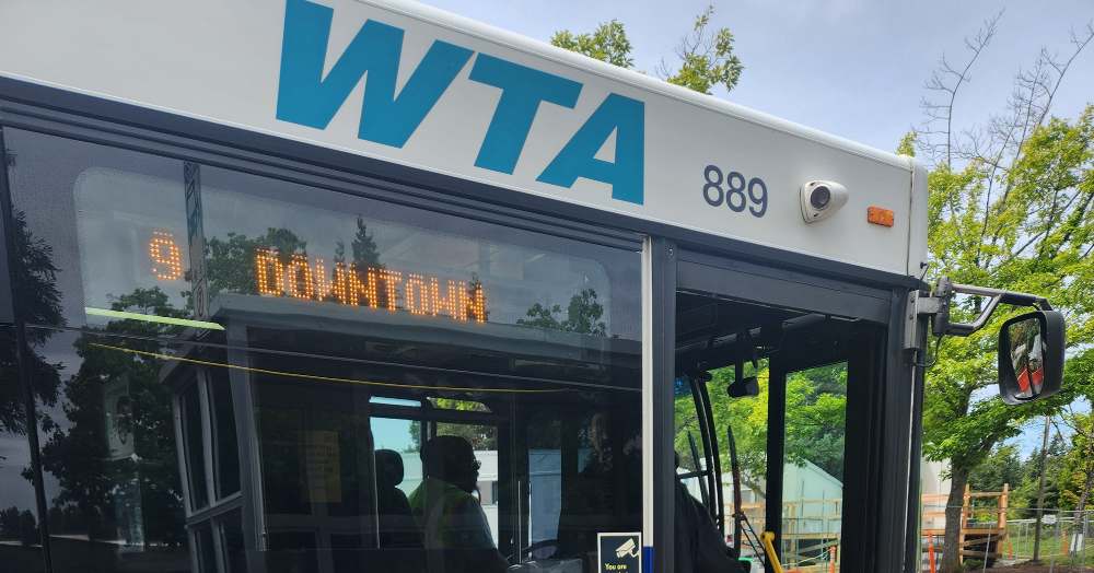 A WTA bus with a sign reading "9 Downtown" and its door open.
